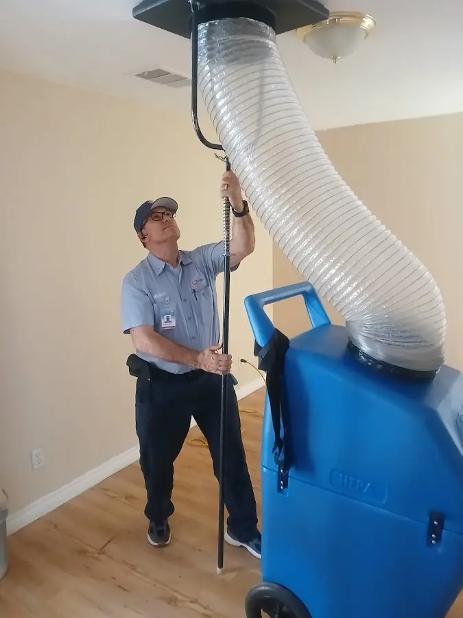 Furnace Tune-Up technician using HEPA equipment in Spanish Fork